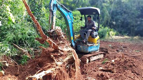 using a mini excavator remove big stumps|digging depth for mini excavators.